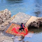 cleaning carpet in river